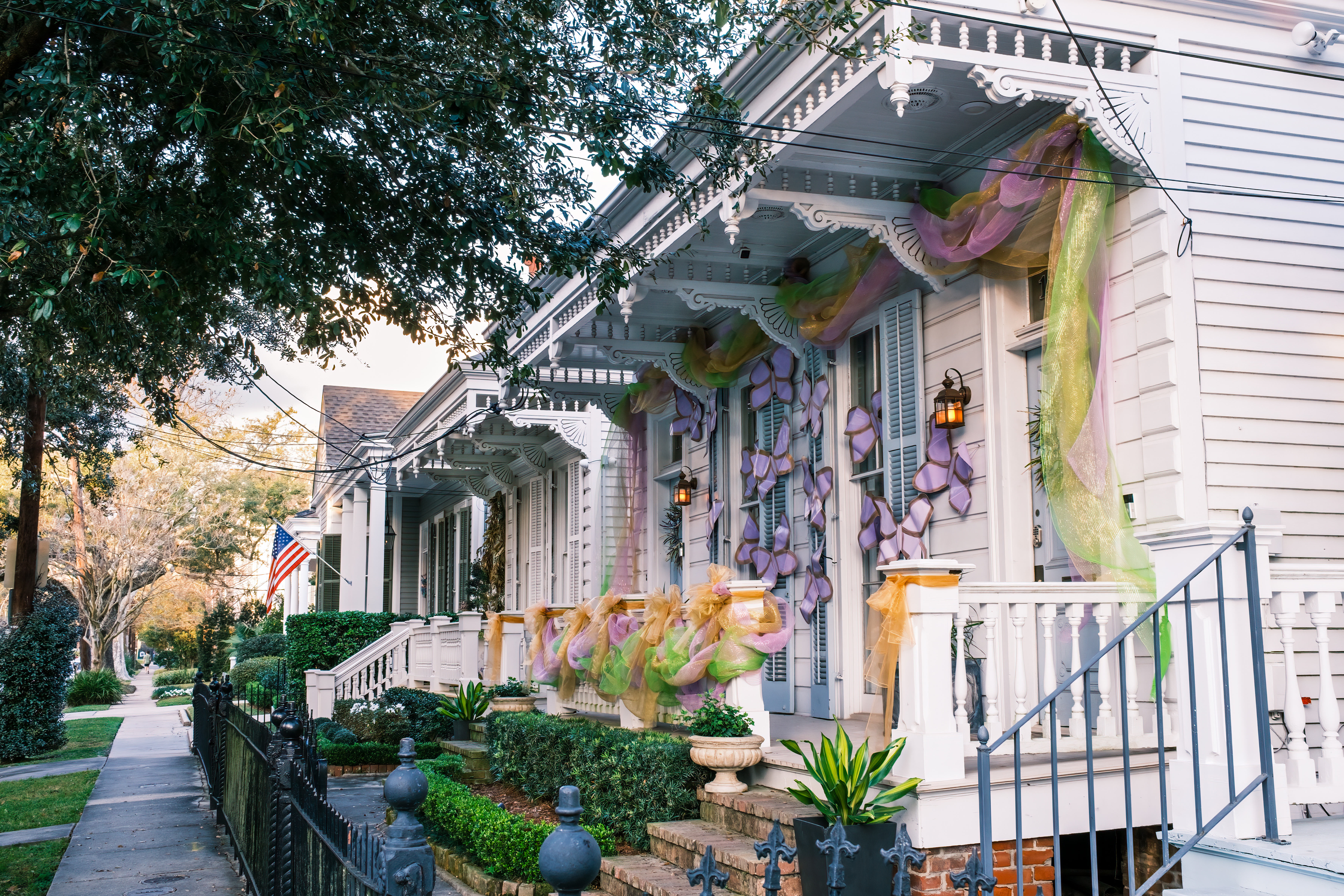 Row of Historic Shotgun Double Houses with Mardi Gras Decorations in New Orleans, Louisiana, USA